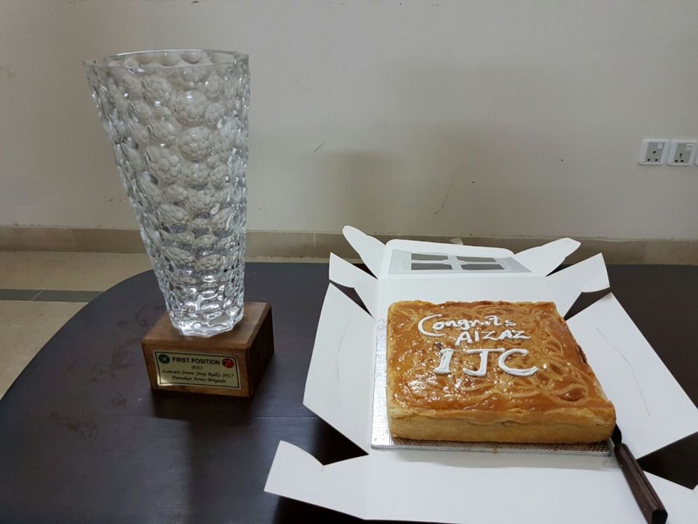 Aizaz Trophy n cake.jpg